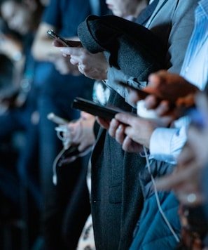 people using phone while standing